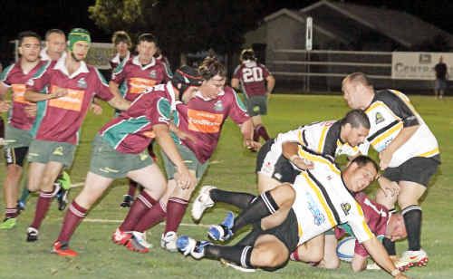 Crushers Bradley Brighton and Dylan Suter move in to join the ruck that Turtles Crushers Bradley Brighton and Dylan Suter move in to join the ruck that Turtles